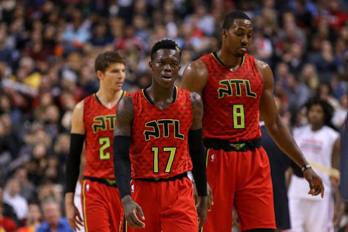 Dennis Schroder (17) of the Atlanta Hawk and Dwight Howard (8) head back to the bench in the third quarter at an NBA game against the Toronto Raptors at Air Canada Centre. Raptors won 128-86.